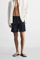 MAILLOT DE BAIN LONG À BANDES CARREAUX