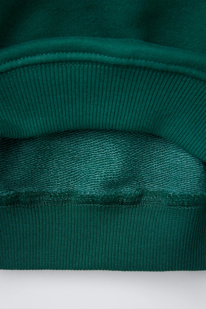 SWEAT À CAPUCHE IMPRIMÉ