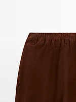 Low-rise cropped suede leather trousers
