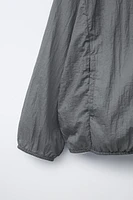 LIGHTWEIGHT PACKABLE WINDBREAKER