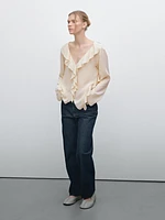 Ruffled blouse with asymmetric hem