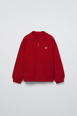 KNIT BOMBER WITH BOW
