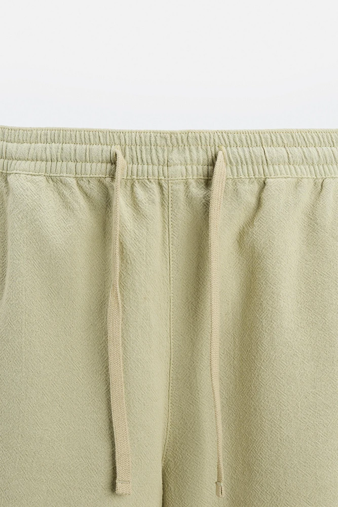 TEXTURED EMBROIDERED SHORTS