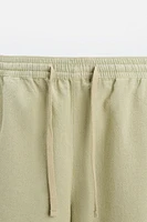 TEXTURED EMBROIDERED SHORTS