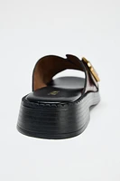 LEATHER CRISS CROSS BUCKLE SANDALS