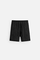 SHORT EN JACQUARD GÉOMÉTRIQUE