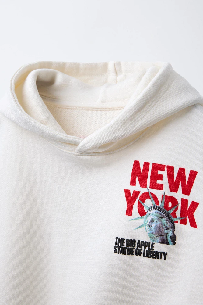 SWEAT À CAPUCHE IMPRIM
