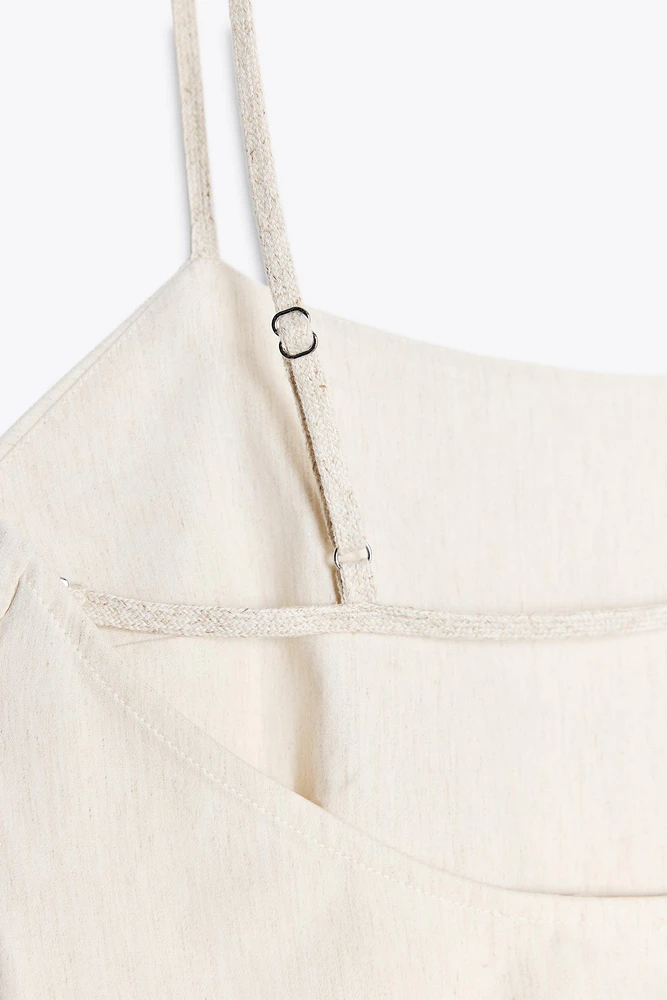 TOP PÉPLUM ASYMÉTRIQUE