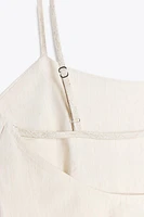 TOP PÉPLUM ASYMÉTRIQUE