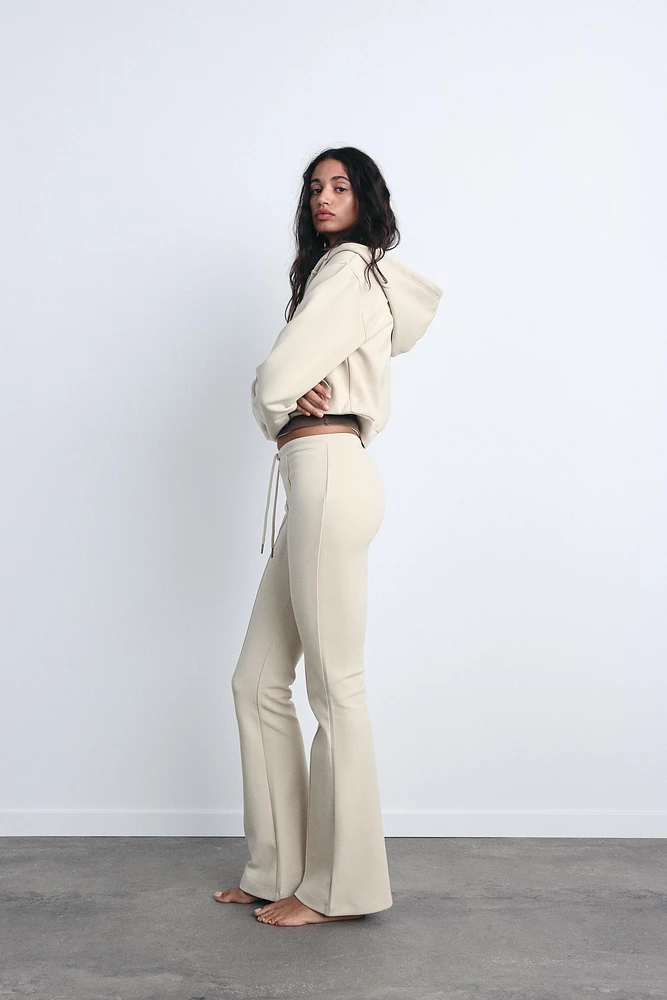 FLARE INTERLOCK PANTS WITH SEAMS