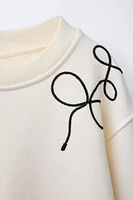 DRAWSTRING TIE SWEATSHIRT