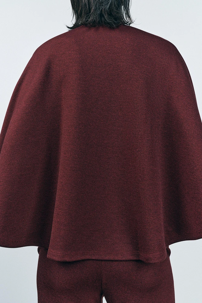 BUTTON CAPE