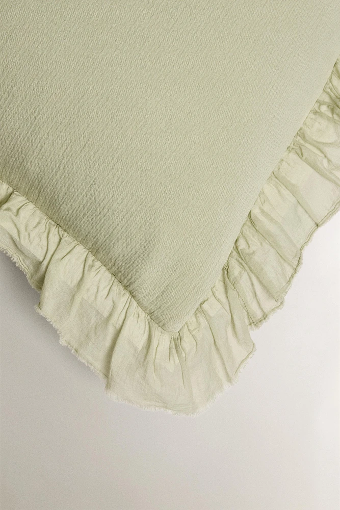 TEXTURED THROW PILLOW COVER WITH RUFFLE TRIM
