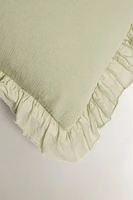 TEXTURED THROW PILLOW COVER WITH RUFFLE TRIM