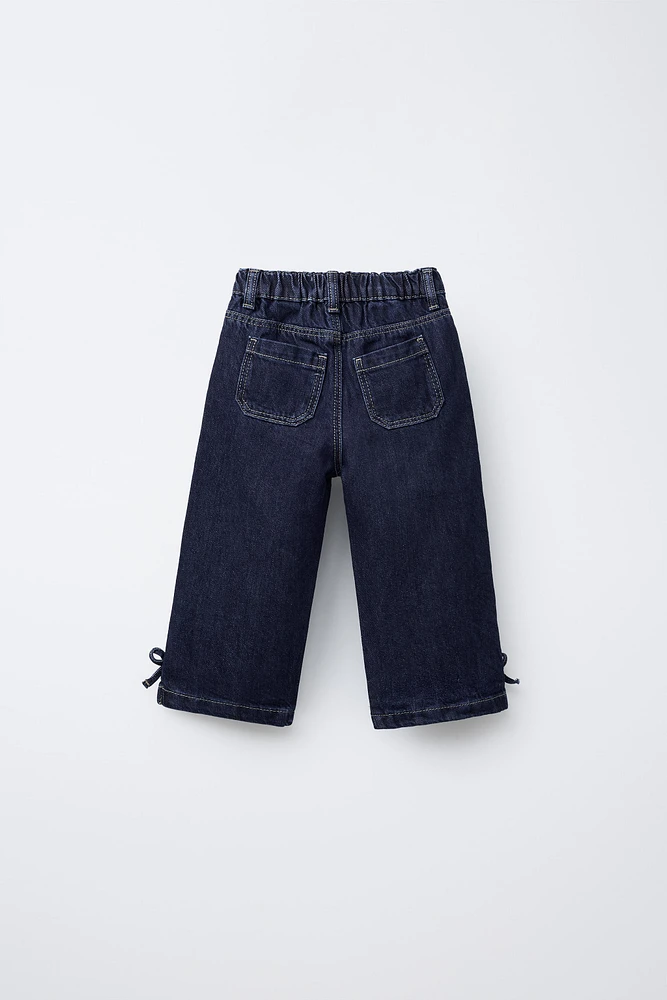 JUPE-CULOTTE EN JEAN À NŒUDS
