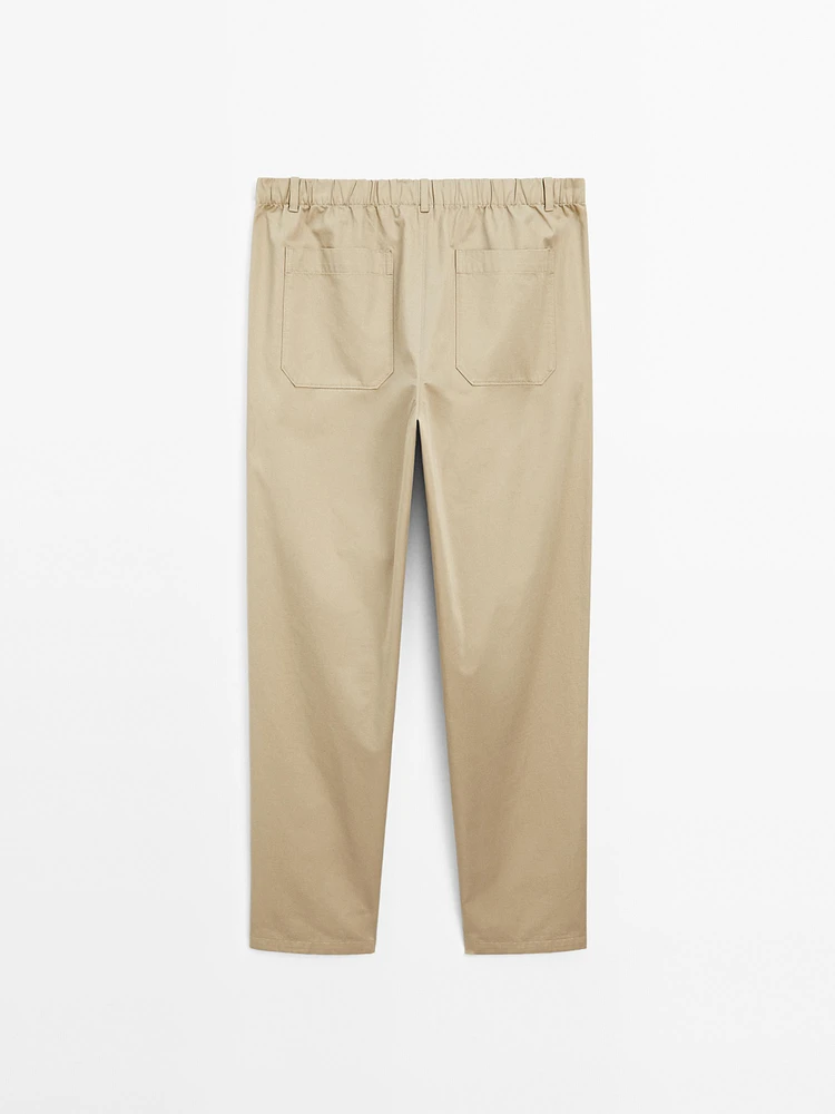 Trousers with patch pocket