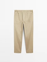 Trousers with patch pocket