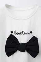 EMBROIDERED TEXT AND BOW T-SHIRT