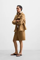 PLEATED FAUX SUEDE SHORTS