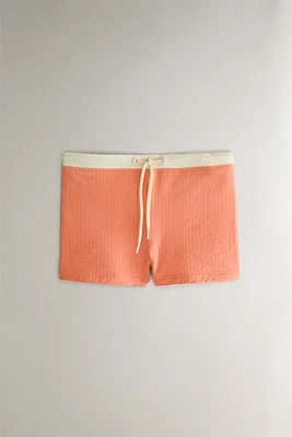 MAILLOT DE BAIN PLAGE ENFANT COULEUR CONTRASTANTE