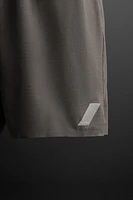 TEXTURED RUNNING SHORTS