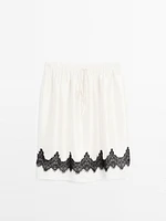 Contrast lace-trimmed skirt
