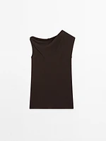 Top asymétrique avec nœud