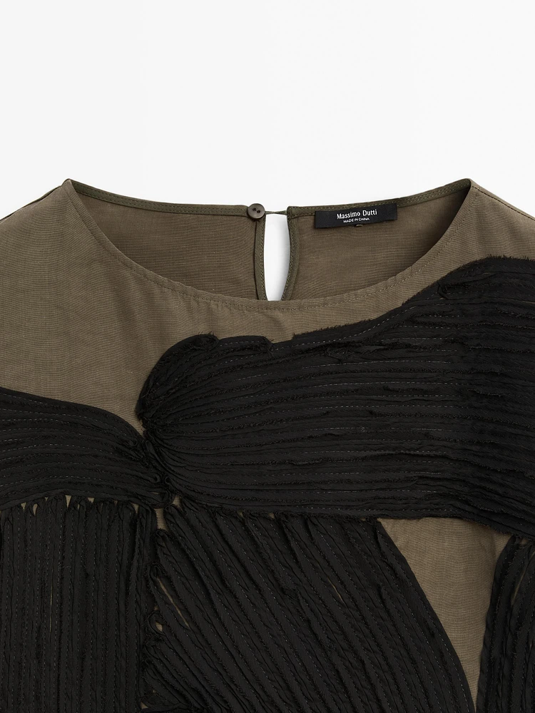 Flowing blouse with contrasting ribbons