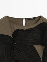 Flowing blouse with contrasting ribbons