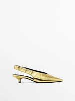 Gold high-heel slingback shoes