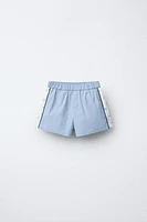 COMBINATION FLORAL TECHNICAL SHORTS