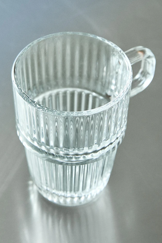 GLASS MUG WITH A RAISED DESIGN