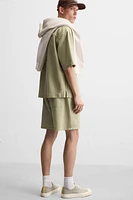 TEXTURED EMBROIDERED SHORTS