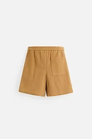 PLEATED FAUX SUEDE SHORTS