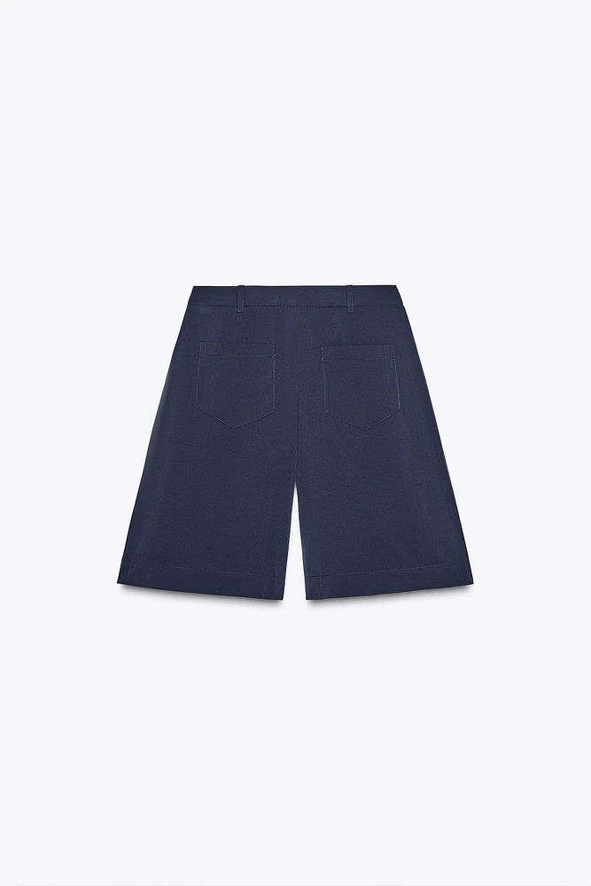 LONG PLEATED SHORTS