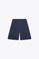 LONG PLEATED SHORTS