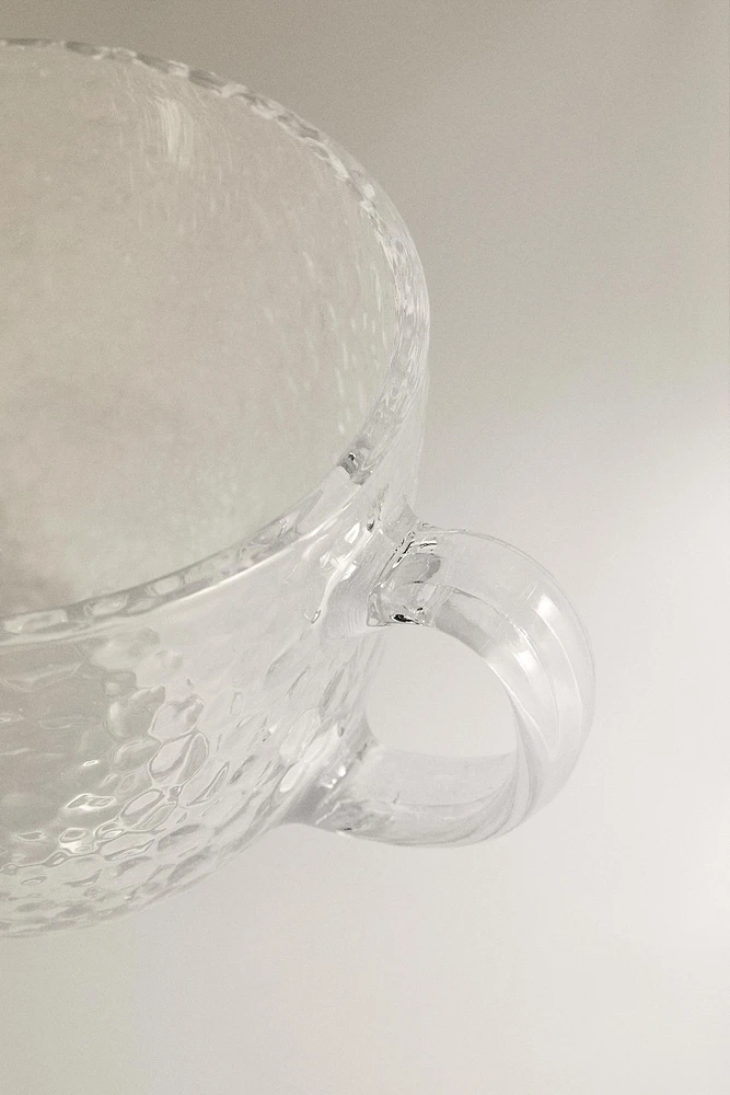 GLASS CUP WITH RAISED DESIGN