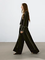 Flowing trousers with contrast topstitching