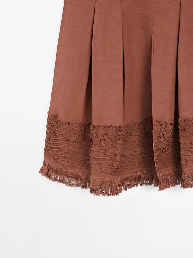 Jupe midi fluide avec broderie