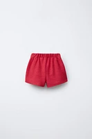 TEXTURED TIE SKORT