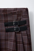 JUPE-SHORT À CARREAUX AVEC BOUCLES