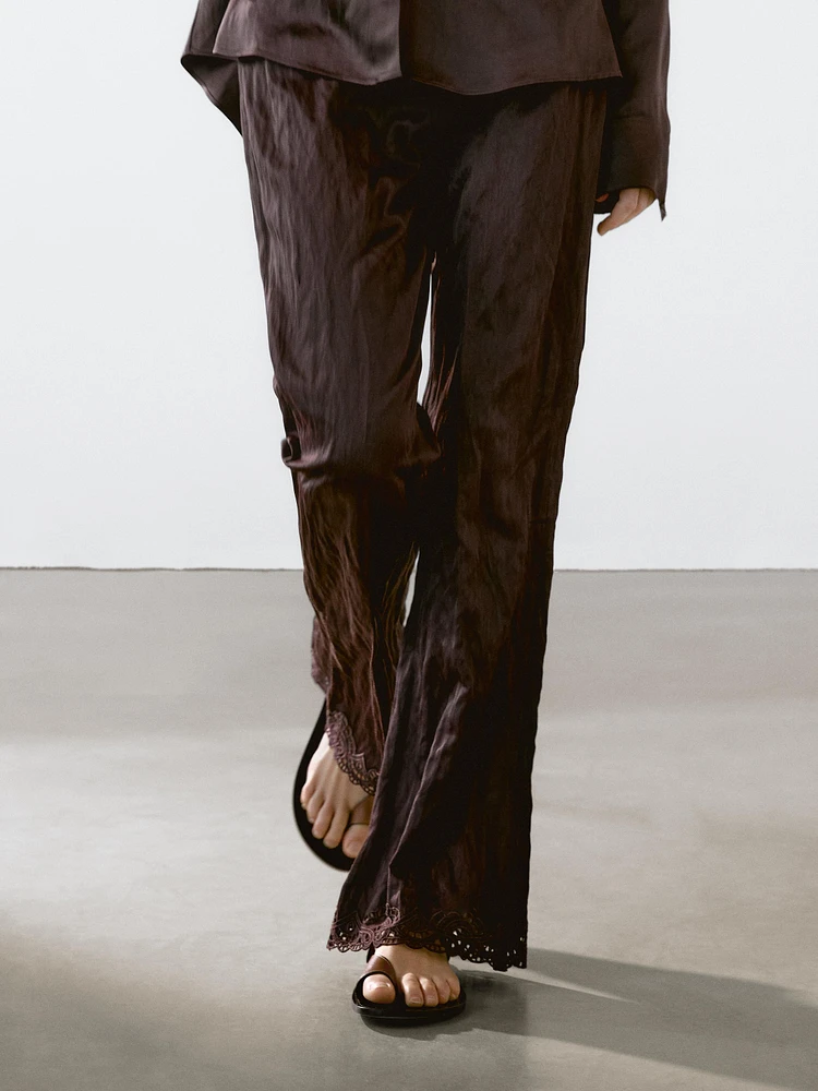 Capri trousers with blonde lace detail