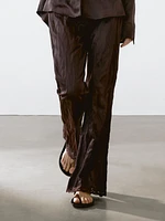 Capri trousers with blonde lace detail