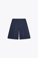 LONG PLEATED SHORTS