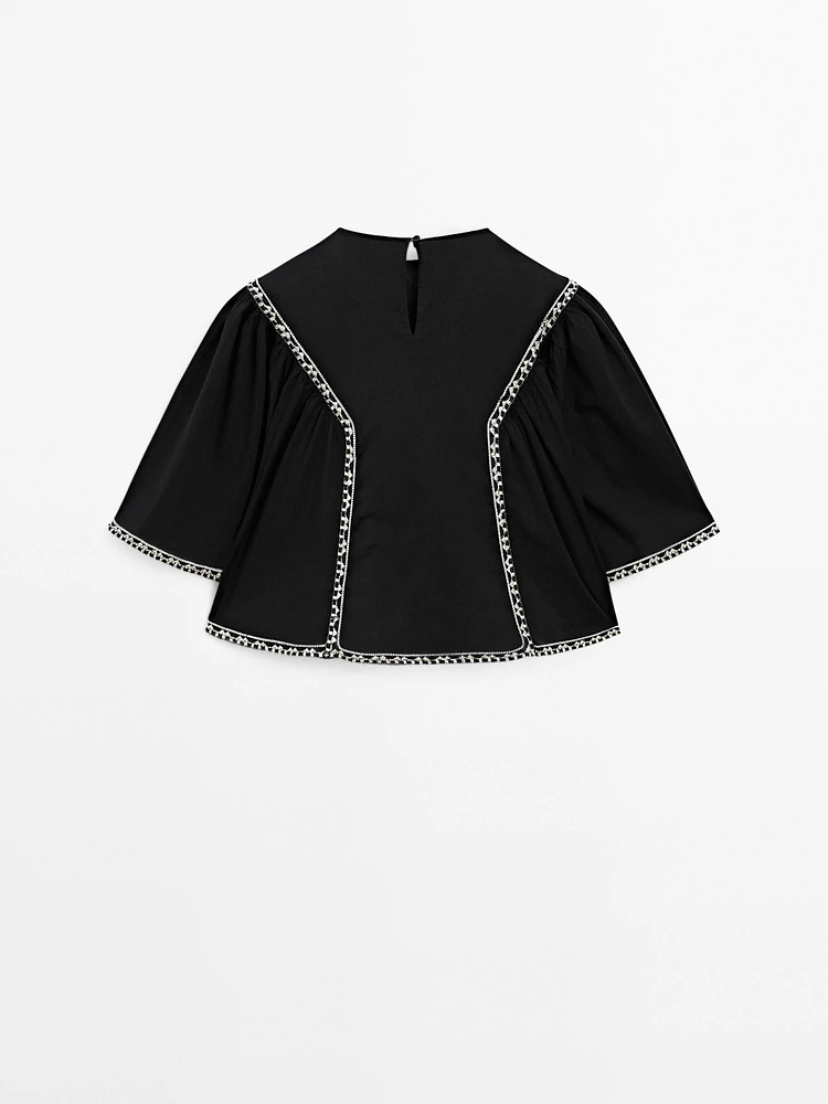Flowing blouse with embroidered details