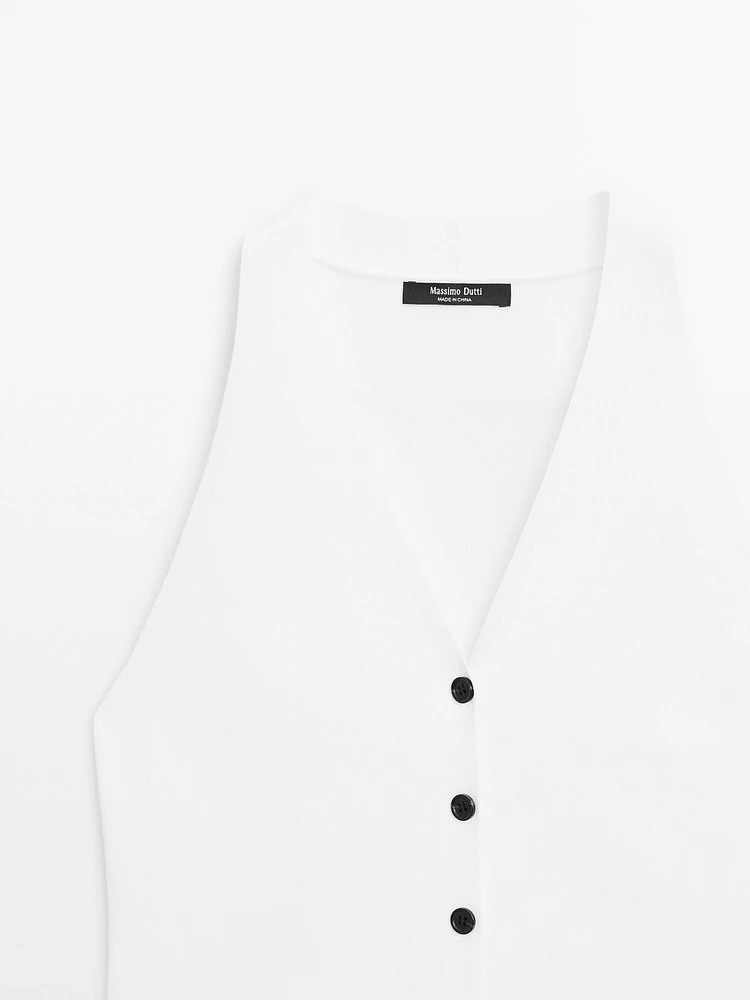 Veste sans manches en maille boutons contrastants