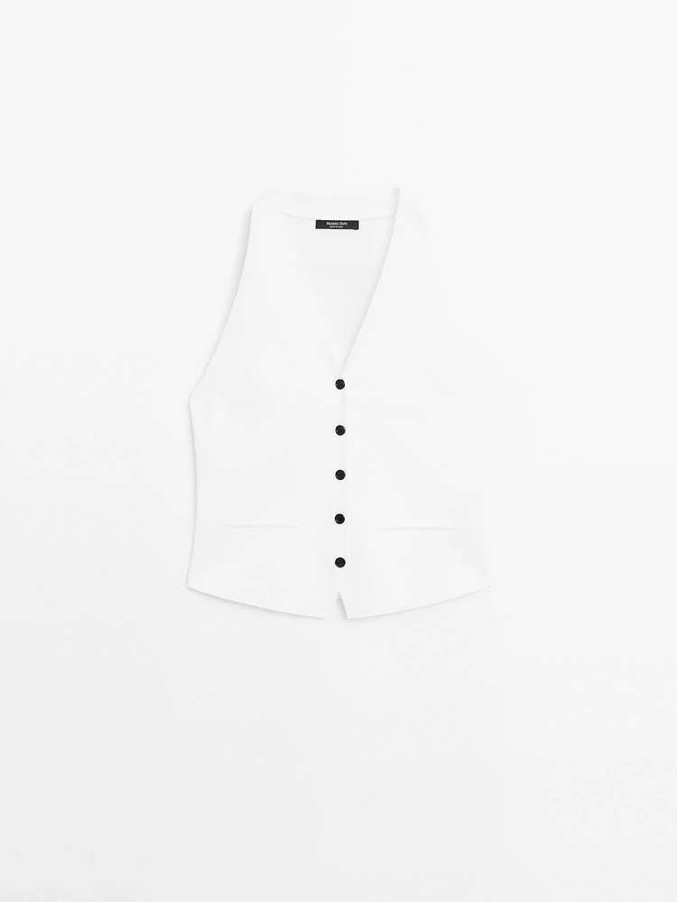 Veste sans manches en maille boutons contrastants
