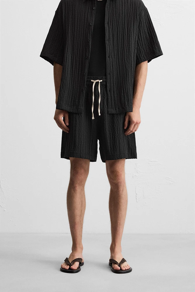 WRINKLED EFFECT JACQUARD BERMUDA SHORTS