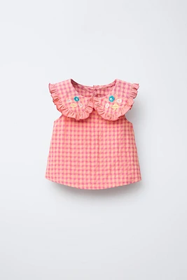 BLOUSE À CARREAUX ET BRODERIES