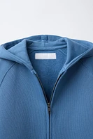 SWEAT À CAPUCHE ZIPPÉ